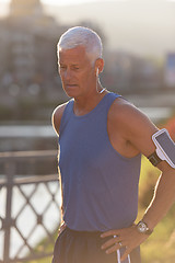 Image showing portrait of handsome senior jogging man