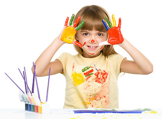 Image showing Portrait of a cute girl playing with paints