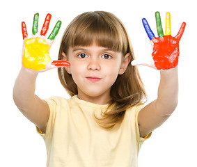 Image showing Portrait of a cute girl playing with paints