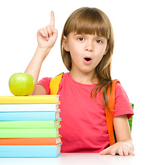 Image showing Little girl with her books