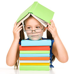 Image showing Little girl with books