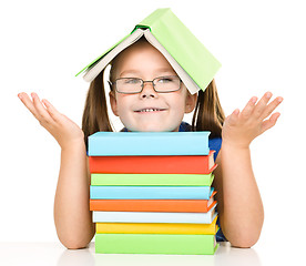 Image showing Little girl with books