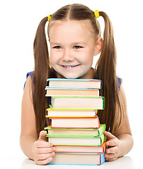 Image showing Little girl with books