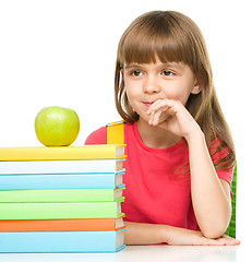 Image showing Little girl with her books