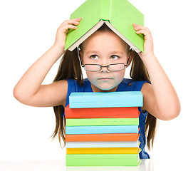 Image showing Little girl with books