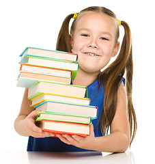 Image showing Little girl with books