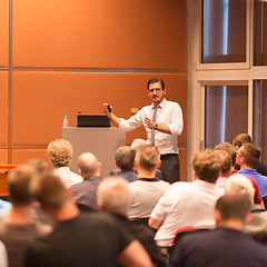 Image showing Business speaker giving a talk in conference hall.