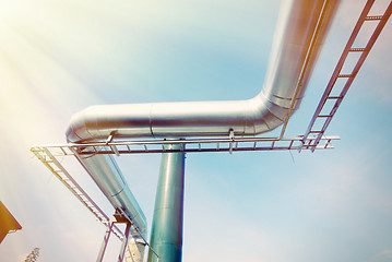 Image showing Industrial zone, Steel pipe-lines on blue sky