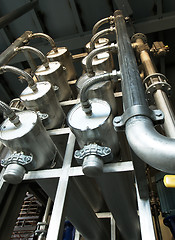 Image showing Equipment, cables and piping as found inside of a modern industr