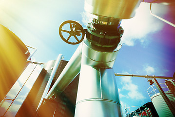 Image showing Industrial zone, Steel pipelines and valves against blue sky