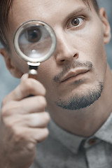 Image showing Man with magnifying glass