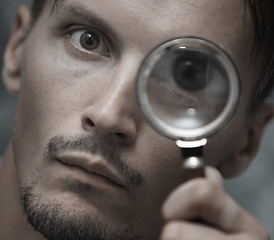 Image showing Man with magnifying glass