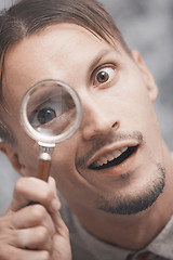 Image showing Man with magnifying glass