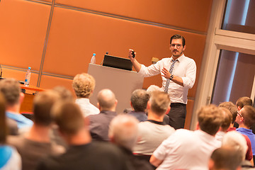 Image showing Business speaker giving a talk in conference hall.