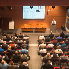 Image showing Business speaker giving a talk in conference hall.