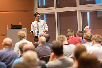 Image showing Business speaker giving a talk in conference hall.