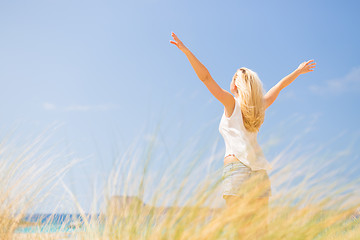 Image showing Free Happy Woman Enjoying Sun on Vacations.