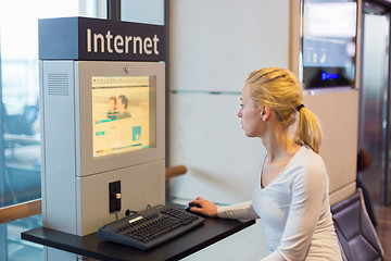 Image showing Woman public internet access point on airport.