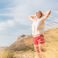 Image showing Free Happy Woman Enjoying Sun on Vacations.