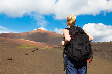 Image showing Woman tracking to top of mountain.