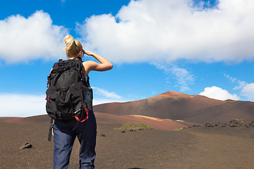 Image showing Woman tracking to top of mountain.