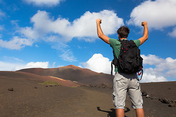 Image showing Man reaching the top of mountain.