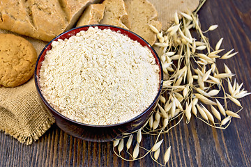 Image showing Flour oat in bowl with bread on sackcloth and board