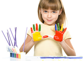 Image showing Portrait of a cute girl playing with paints