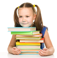 Image showing Little girl with books