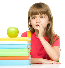 Image showing Little girl with her books