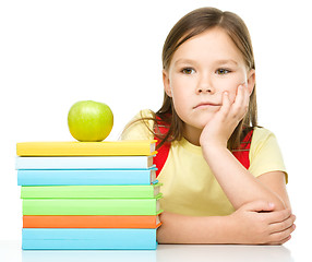 Image showing Little girl with her books