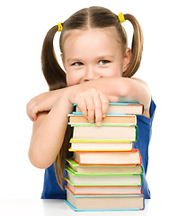 Image showing Little girl is showing her books