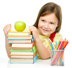 Image showing Little girl with her books