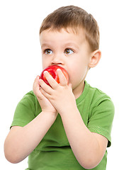 Image showing Portrait of a cute little boy with red apple