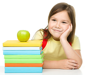 Image showing Little girl with her books