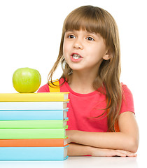 Image showing Little girl with her books