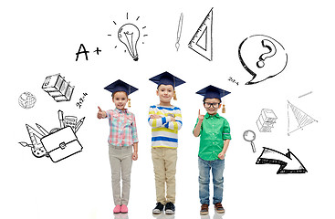 Image showing happy children in bachelor hats and eyeglasses