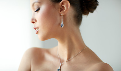 Image showing beautiful asian woman with earring and pendant