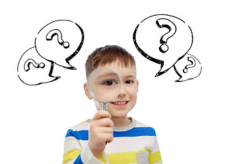 Image showing happy little boy looking through magnifying glass