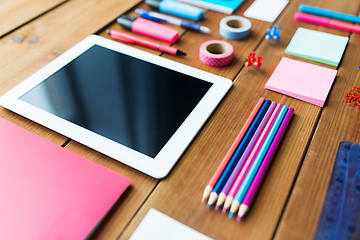 Image showing close up of school supplies and tablet pc