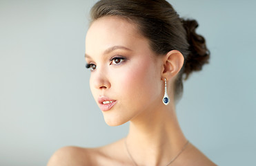 Image showing close up of beautiful woman face with earring