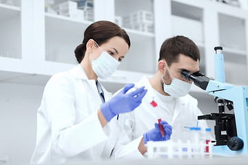 Image showing young scientists making test or research in lab