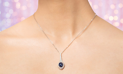 Image showing close up of beautiful woman neck with pendant