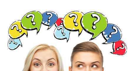 Image showing happy young women faces with question marks