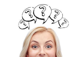 Image showing happy young woman head with question marks