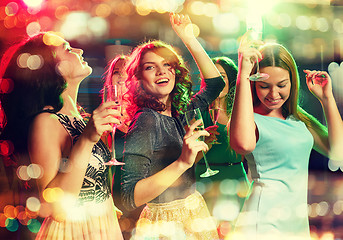 Image showing smiling friends with glasses of champagne in club