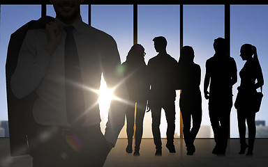 Image showing people silhouettes over office background