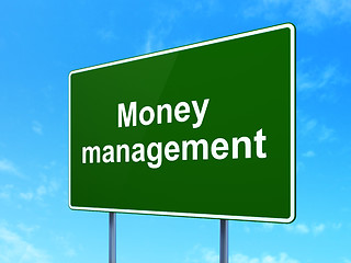Image showing Currency concept: Money Management on road sign background