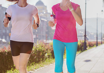 Image showing female friends jogging