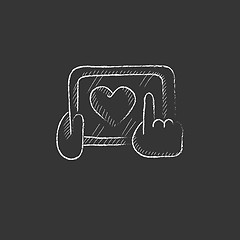 Image showing Hands holding tablet with heart sign. Drawn in chalk icon.